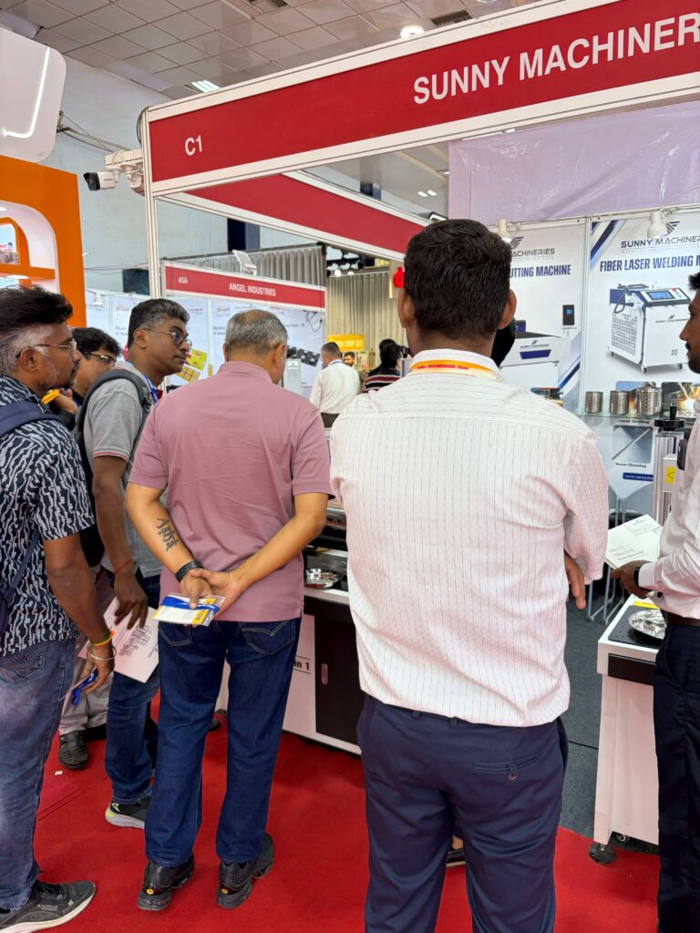 Sunny Machineries exhibition booth at Indian Houseware Show 2026 featuring laser marking, fiber laser welding, and fiber laser cutting solutions for stainless steel and aluminium utensils.
